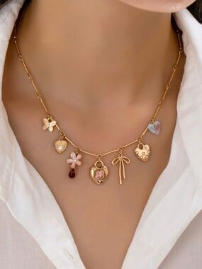 NWT Josslyn Charm Necklace Hearts Flower Bow Butterfly Gold Tone Pendant Jewelry